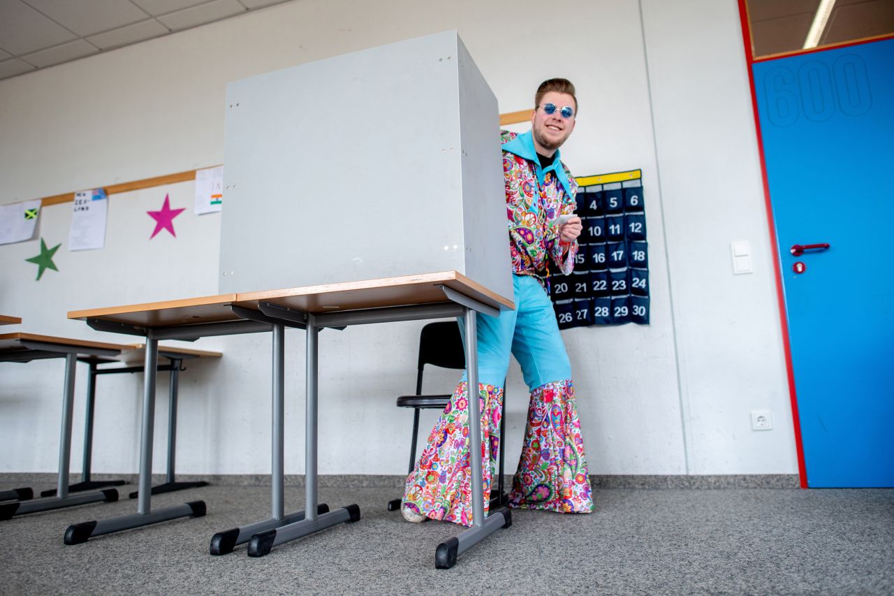 23 February 2025, Lower Saxony, Damme: Costumed voter Nico leaves the privacy of the polling booth at a polling station after casting his vote. The early election to the 21st German Bundestag takes place on Sunday. In Damme, Lower Saxony, the Bundestag election coincides with the traditional Damme carnival, which is traditionally celebrated a week before the actual Rose Monday. Photo: Hauke-Christian Dittrich/dpa (Photo by Hauke-Christian Dittrich/picture alliance via Getty Images)