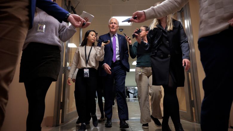 Sen. John Cornyn talks with reporters as he arrives at the US Capitol in Washington, DC, on February 20.