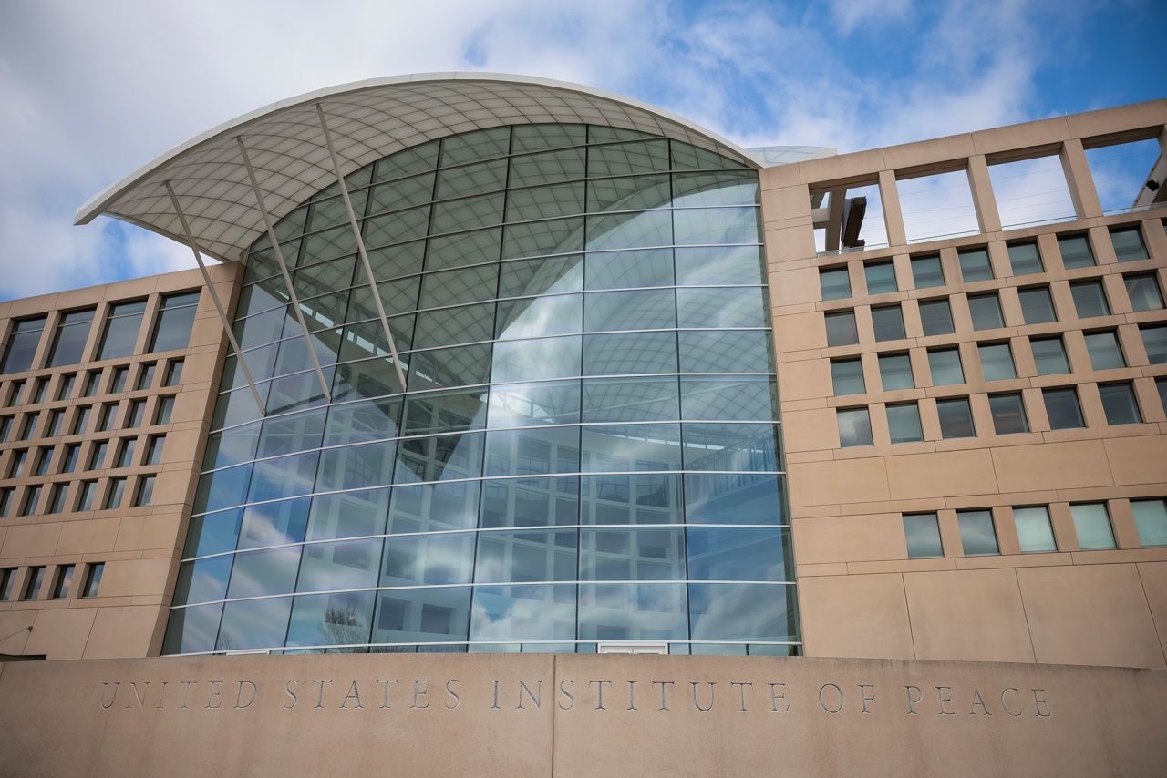 A sign for the United States Institute of Peace is seen on its building headquarters in Washington, on February 20.