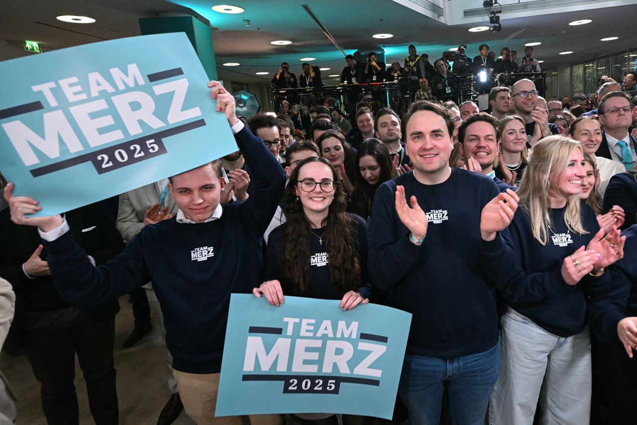 Supporters of the Christian Democratic Union (CDU) react after the first exit polls in the German general elections were announced on TV during the electoral evening in Berlin on February 23, 2025. (Photo by INA FASSBENDER / AFP) (Photo by INA FASSBENDER/AFP via Getty Images)