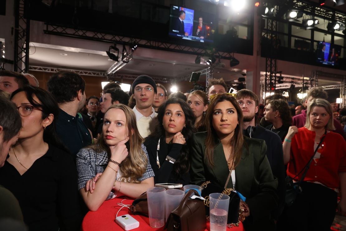 Attendees react to exit poll results during a Social Democrats (SPD) election night event in Berlin, Germany, on Sunday, Feb. 23, 2025. Germany's conservative opposition leader Friedrich Merz is projected to win Sunday's federal election, comfortably finishing ahead of the far-right AfD party and Chancellor Olaf Scholz's Social Democrats. Photographer: Alex Kraus/Bloomberg via Getty Images