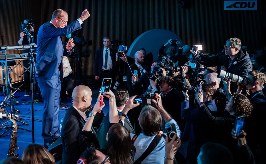 Friedrich Merz stands on stage during the election party in the Konrad Adenauer House in Berlin on February 23, 2025.