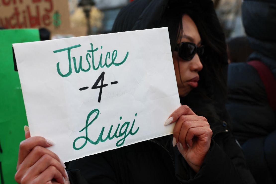 NEW YORK, NEW YORK - FEBRUARY 21: Supporters of Luigi Manigione hold a protest outside of Manhattan Criminal Court on February 21, 2025 in New York City. Luigi Mangione is accused of slaying of UnitedHealthcare CEO Brian Thompson late last year and is making his first appearance on state charges of murder as an act of terrorism. He is facing 11 counts for the Dec. 4 shooting of Thompson outside a midtown Manhattan hotel which set off a massive manhunt. He is also facing federal charges of murder and other charges in Pennsylvania, where he was arrested. (Photo by Michael M. Santiago/Getty Images)