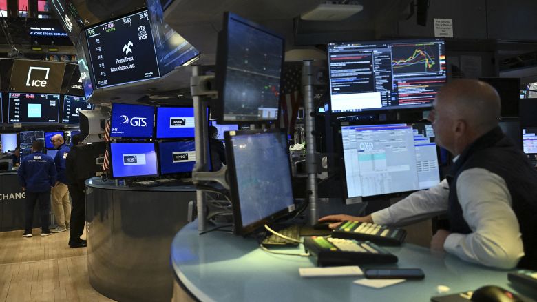 Traders work on the floor of the New York Stock Exchange (NYSE) following the opening bell in New York City on February 24, 2025.