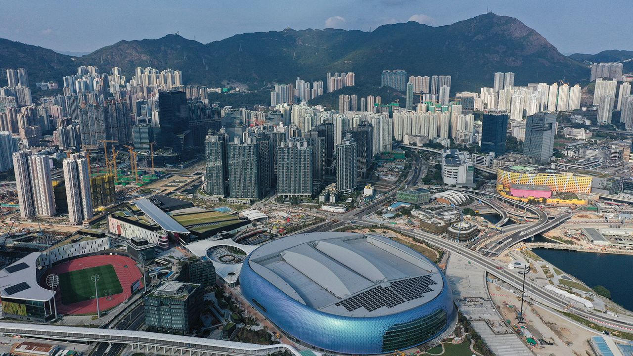 This photo shows an aerial view of apartment blocks and the Kai Tak Sports Park in East Kowloon in Hong Kong on February 24, 2025.