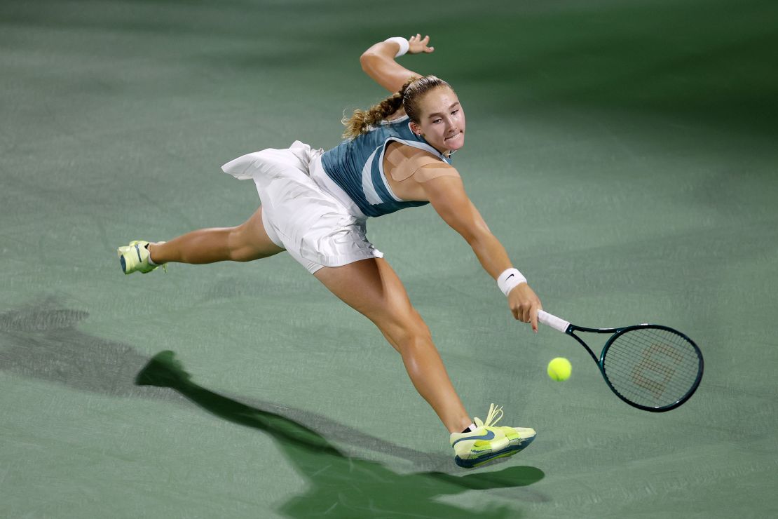 Andreeva plays a backhand against Tauson in the final.