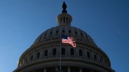 A US flag flies near the dome of the US Capitol in Washington, DC, on February 25, 2025.