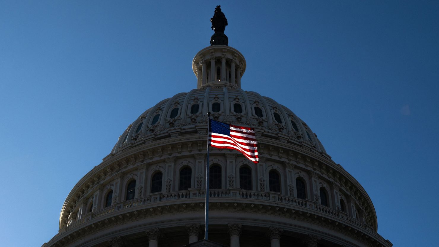 A US flag flies near the dome of the US Capitol in Washington, DC, on February 25, 2025.