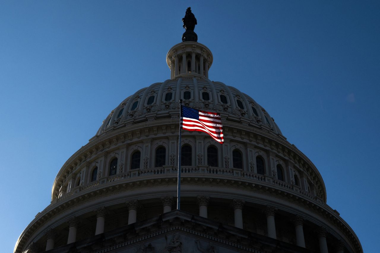 A US flag flies near the dome of the US Capitol in Washington, DC, on February 25.