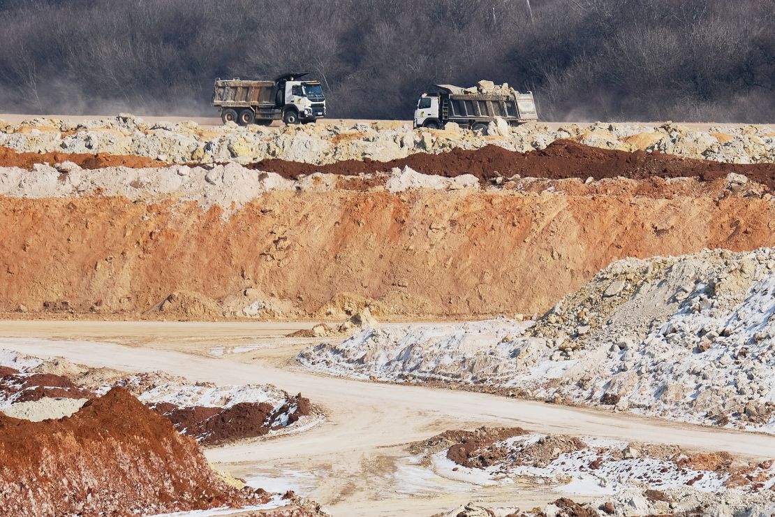 Earth and minerals are loaded onto trucks at a mine near the front line in Donetsk, Ukraine, in February.