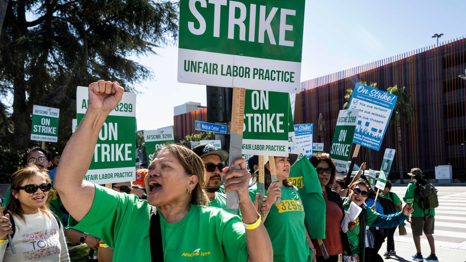 A union member chants while protesting with University Professional and Technical Employees-CWA Local 9119 and AFSCME Local 3299 in front of UC Irvine Medical Center in Orange, California, on Wednesday.