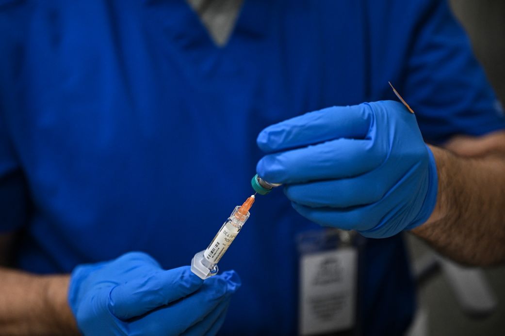 A health worker prepares a dose of the measles vaccine in Lubbock, Texas, in February.