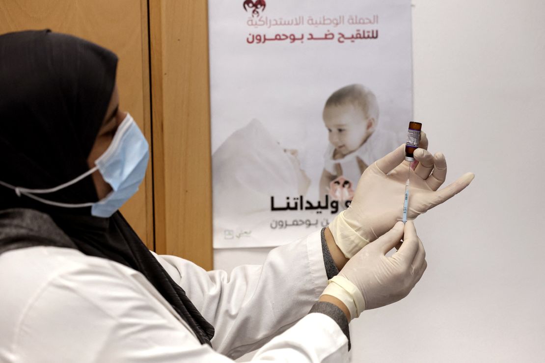 A nurse prepares a dose of measles vaccine in Morocco in February. Authorities in Morocco have been scrambling to contain an outbreak of measles.