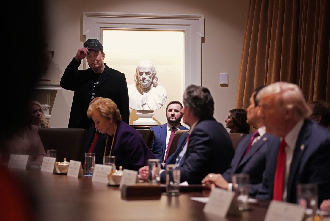 Elon Musk pronounces remarks at a meeting of the cabinet held by President Donald Trump at the White House on February 26, 2025 in Washington, DC.