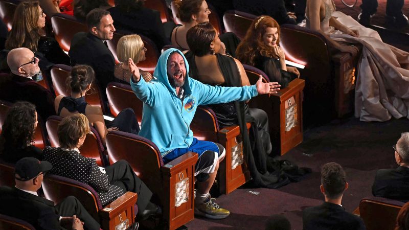 Adam Sandler’s trademark casualwear mocked by Oscars host Conan O’Brien