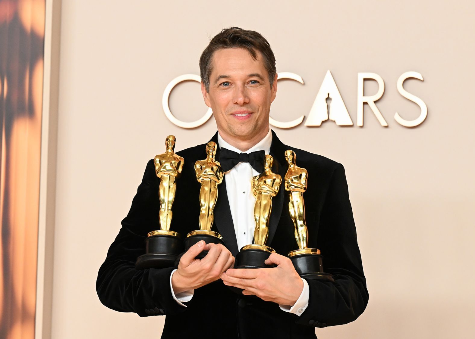 "Anora" director Sean Baker holds his four Oscars after the show. He won best picture, best directing, best editing and best original screenplay.