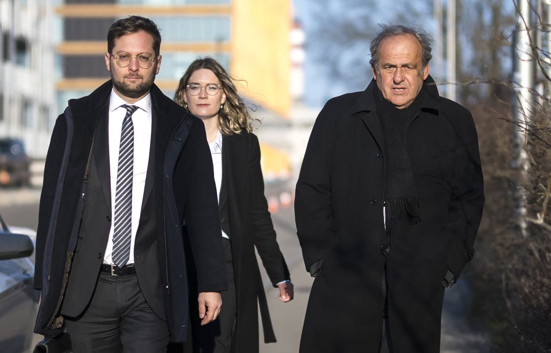 Former UEFA president Michel Platini (right) arrives at the court house in Muttenz on March 3.