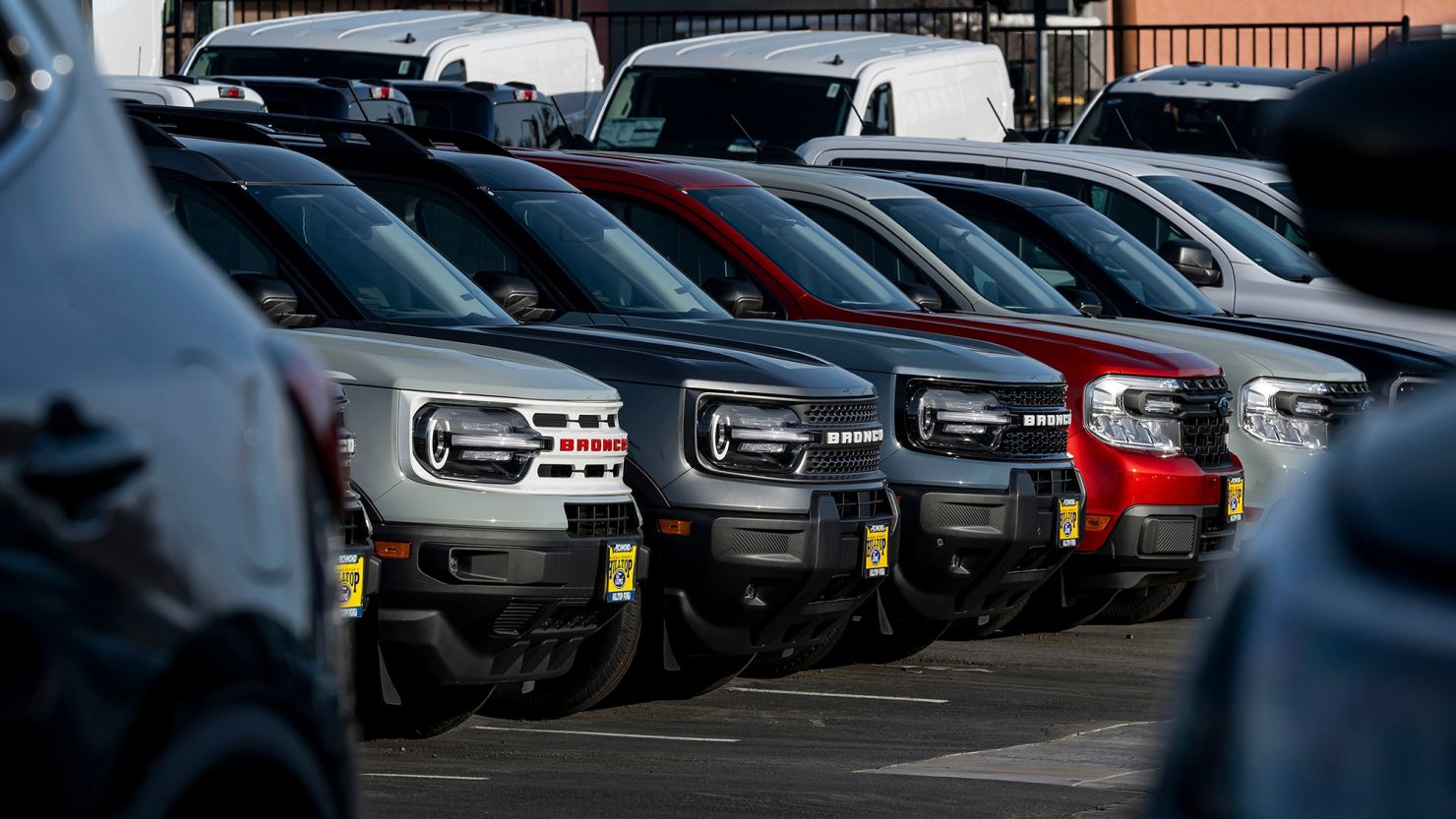 Ford Bronco vehicles at a Ford dealership in Richmond, California, on March 3, 2025. Tariffs on imported autos and parts risk driving up US car prices, but there have been few announcements from companies raising prices. Photographer: David Paul Morris/Bloomberg via Getty Images