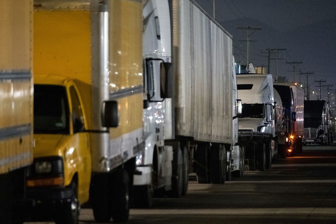 Trucks queue near the Mexico-US border while waiting for the port to open at the Otay Commercial crossing in Tijuana, Mexico, on March 4, 2025.