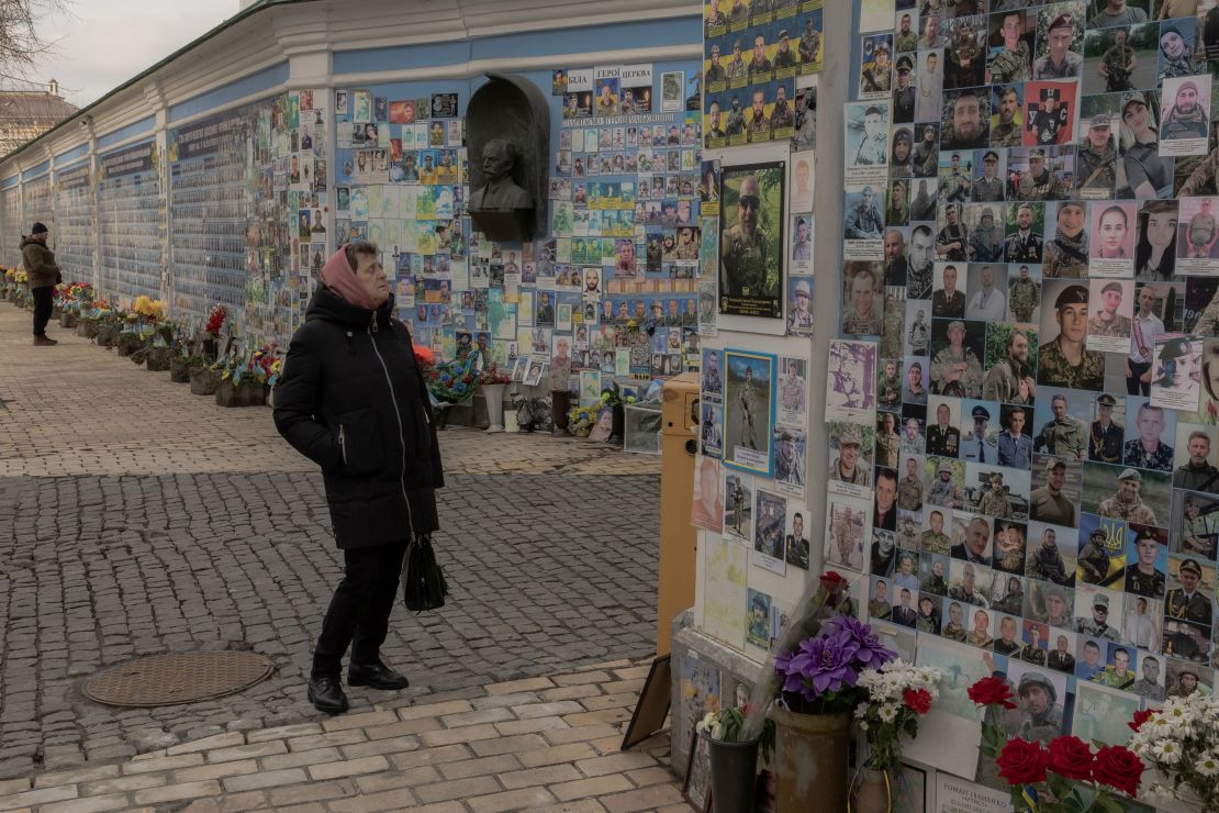 A woman visits the 'Wall of Remembrance of the Fallen for Ukraine' in downtown Kyiv on March 4, 2025.