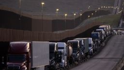 Trucks queue near the Mexico-US border before crossing the border at Otay Commercial crossing in Tijuana, Baja California state, Mexico, on March 4, 2025. Stinging US tariffs on Canadian and Mexican goods came into effect as a deadline to avert President Donald Trump's levies passed without the nations striking a deal -- a move set to snarl supply chains. Mexico will hit back at Trump's tariffs with retaliatory duties of its own, President Claudia Sheinbaum said, accusing Washington of "defamatory" claims against her government. (Photo by Guillermo Arias / AFP) (Photo by GUILLERMO ARIAS/AFP via Getty Images) 