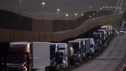 Trucks queue near the Mexico-US border before crossing the border at Otay Commercial crossing in Tijuana, Baja California state, Mexico, on March 4, 2025. Stinging US tariffs on Canadian and Mexican goods came into effect as a deadline to avert President Donald Trump's levies ed without the nations striking a deal -- a move set to snarl supply chains. Mexico will hit back at Trump's tariffs with retaliatory duties of its own, President Claudia Sheinbaum said, accusing Washington of "defamatory" claims against her government. (Photo by Guillermo Arias / AFP) (Photo by GUILLERMO ARIAS/AFP via Getty Images)          