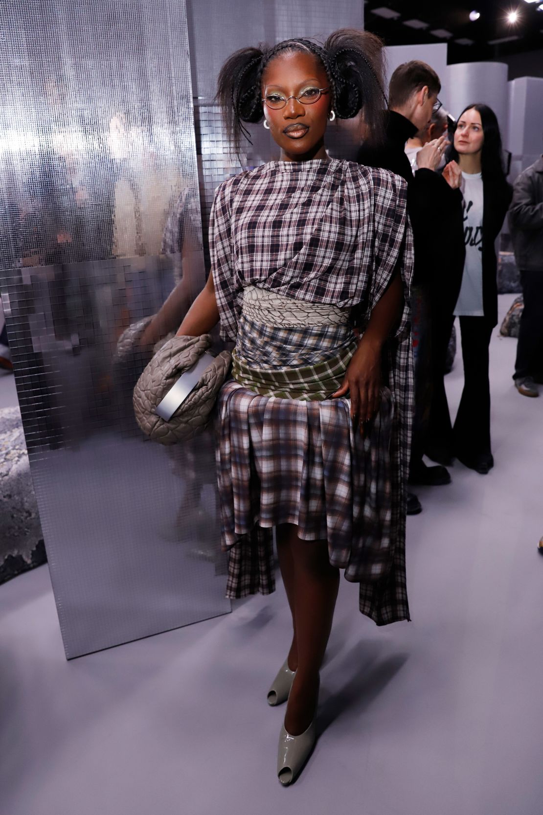 Rapper Doechii embraced a geek-chic look with a tartan skirt-set and glasses at Acne Studios.