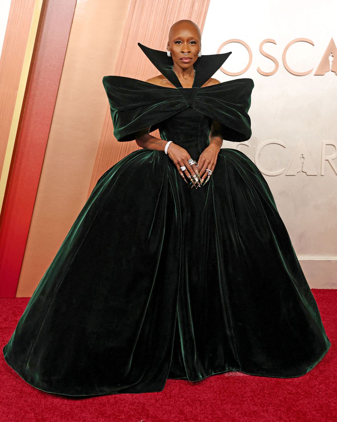 Best Actress nominee Cynthia Erivo arrived on the red carpet in a dramatic custom Louis Vuitton look: a green velvet gown with exaggerated sleeves and raised neckline.