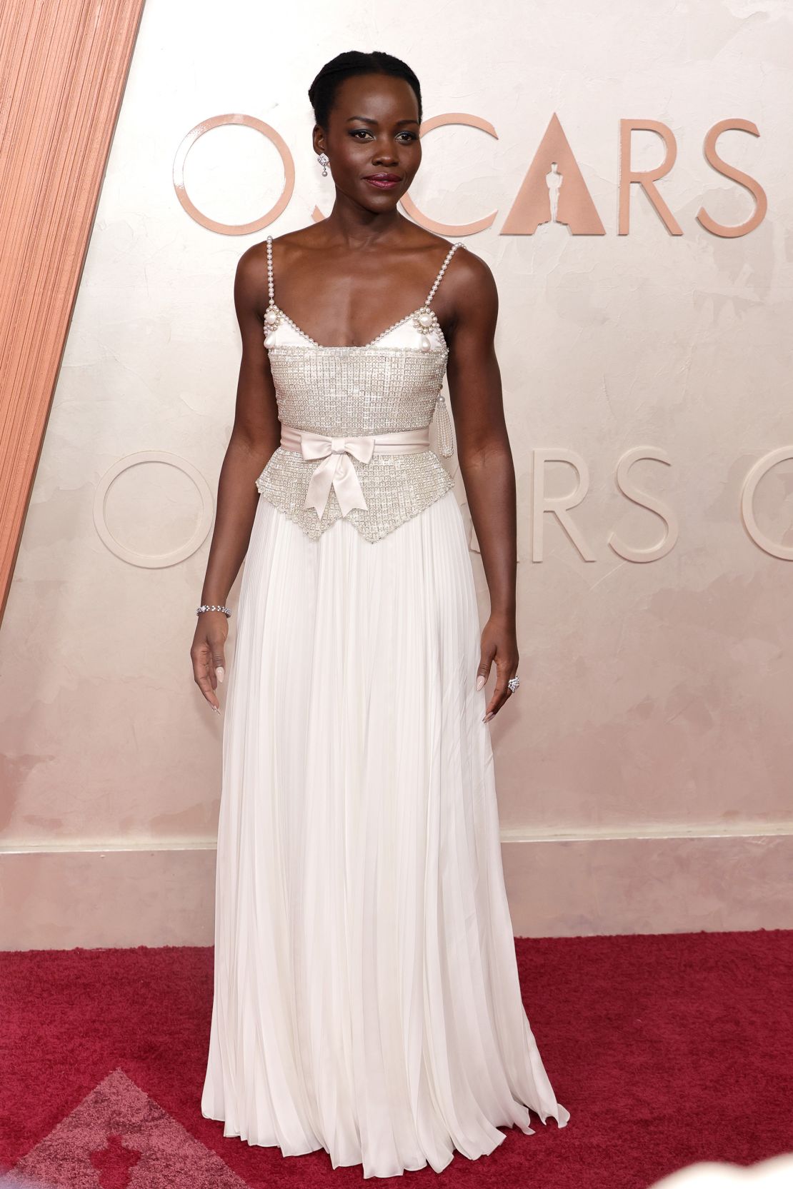 Lupita Nyong'o, who stars in Best Animated Feature nominee “Wild Robot,” sparkled in a custom Chanel ivory dress embellished with over 22,000 embroidery elements.