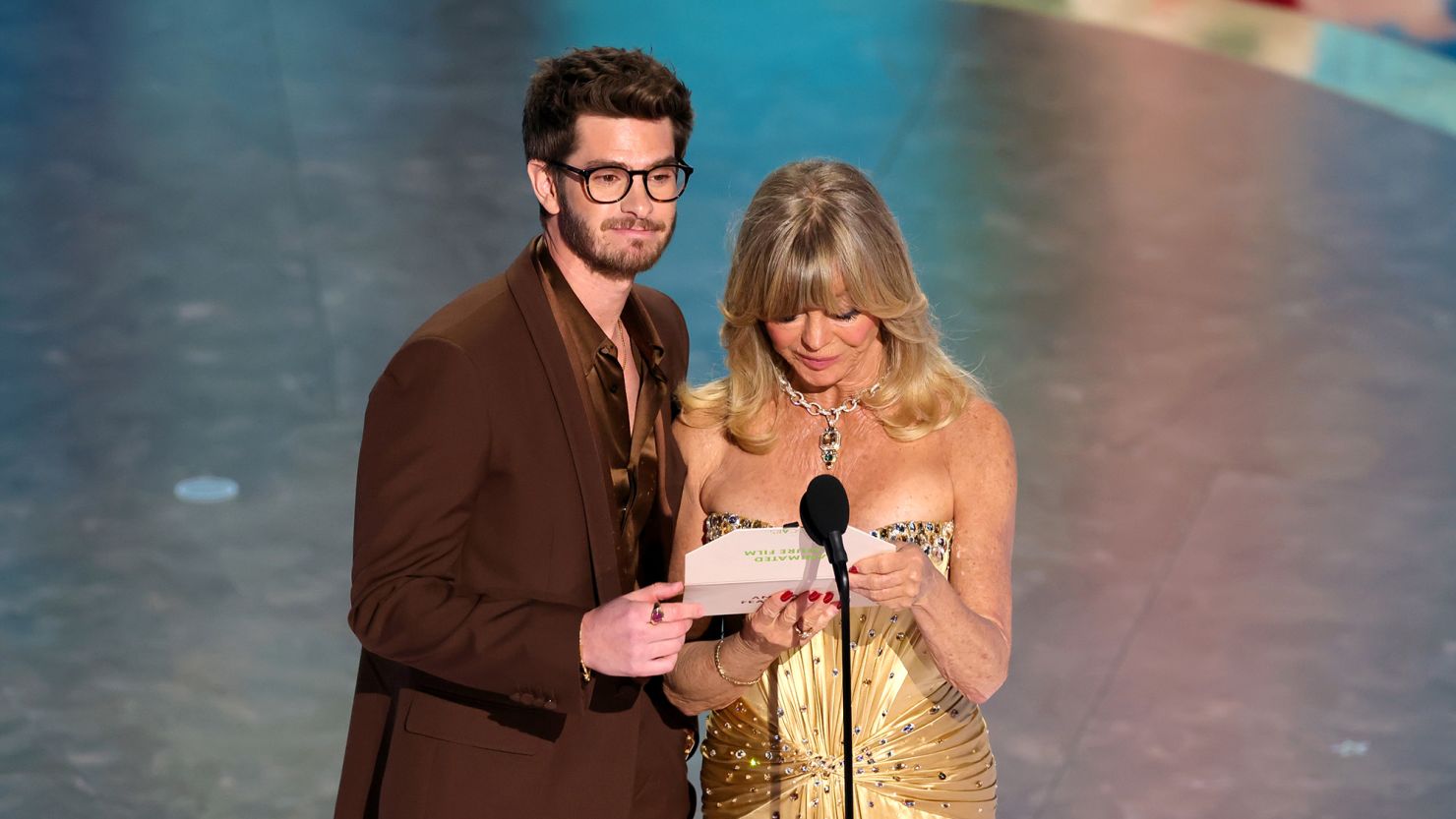 Andrew Garfield (left) and Goldie Hawn (right) pictured on stage at the Oscars.