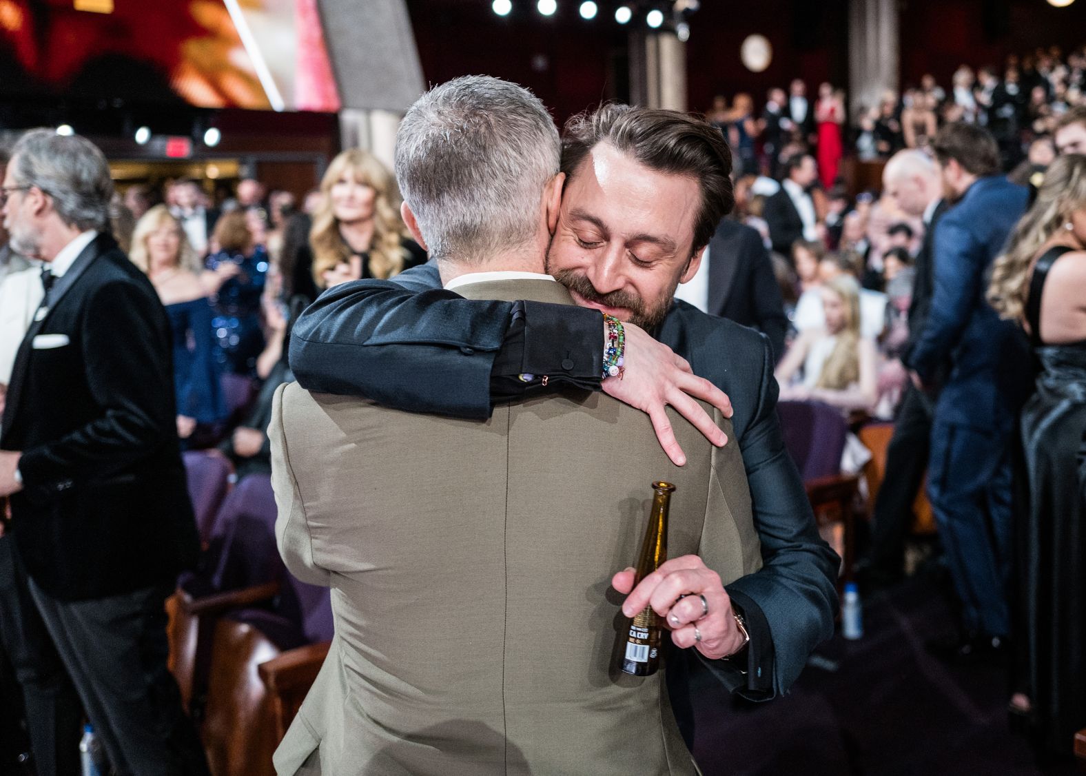 Culkin, who won the Oscar for best supporting actor for his role in "A Real Pain," gets a hug from Jeremy Strong at the Dolby Theatre. The two starred in the show "Succession."