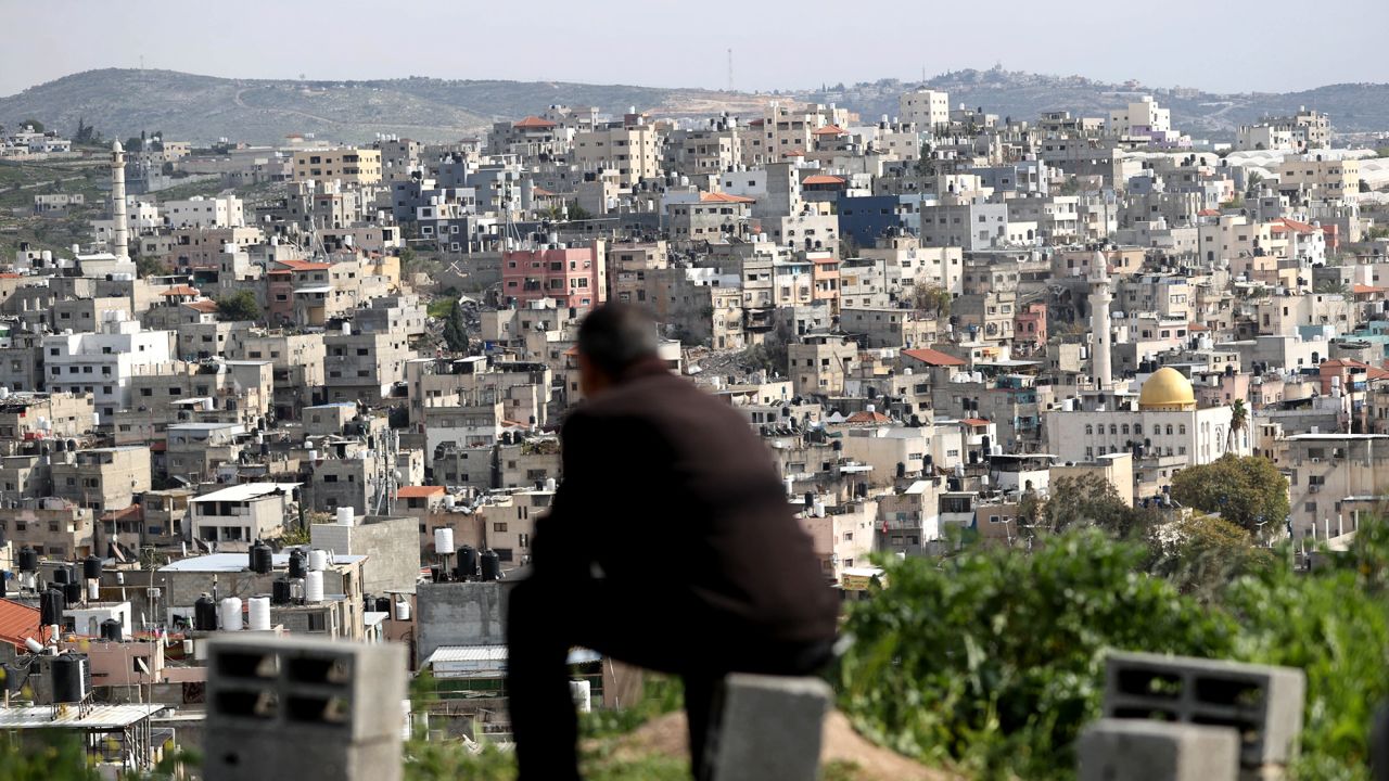A man looks over the Nur al-Shams Refugee Camp, east of Tulkarm city in the occupied West Bank in March.