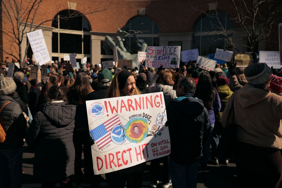 Hundreds of demonstrators gather to protest against Department of Government Efficiency cuts outside the headquarters of the National Oceanic and Atmospheric Administration on March 3 in Silver Spring, Maryland.