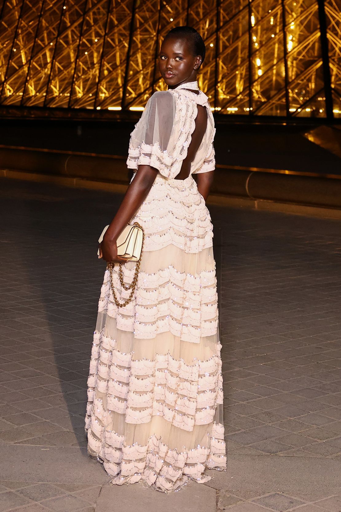 Model Adut Akech also opted for a ruffled Valentino look at Le Grand Dîner du Louvre.