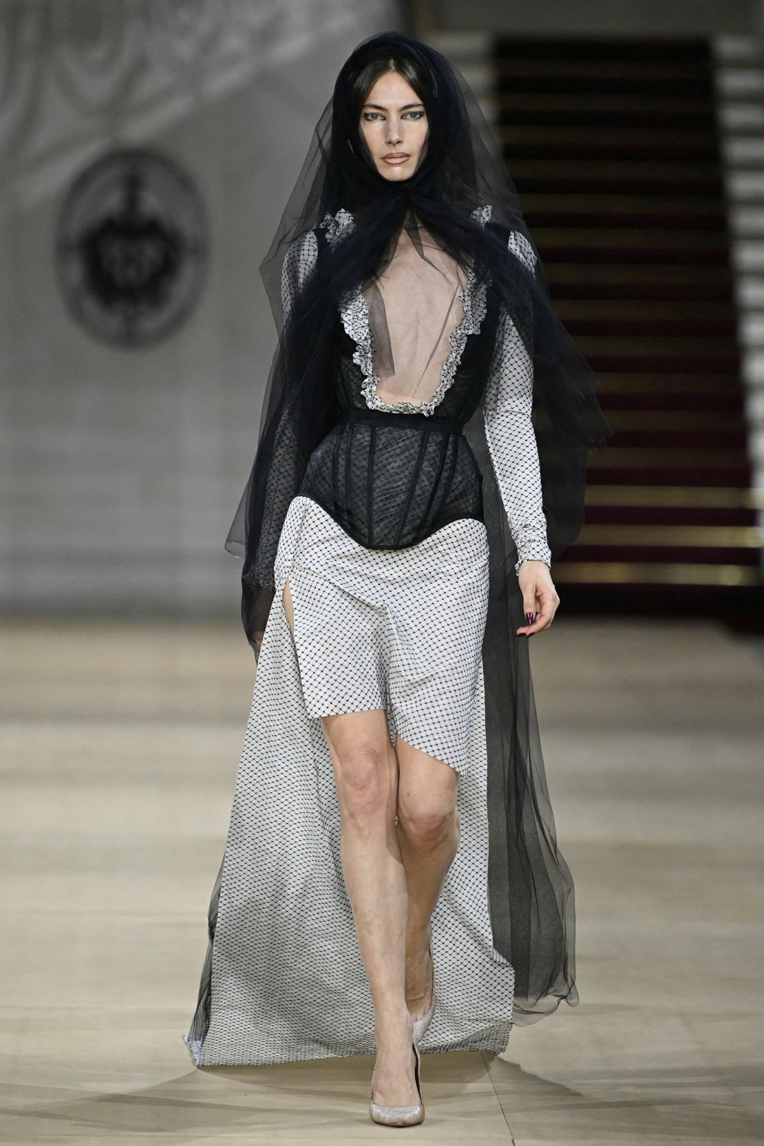 Black bridal veils and sheer corsets were presented at Vivienne Westwood.