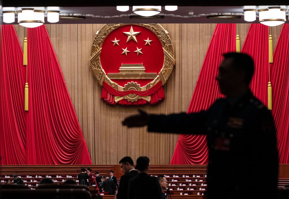 Delegates and security wait before the opening session of the National People's Congress at the Great Hall of the People in Beijing, China, on March 5, 2025.