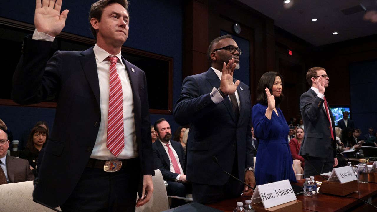 WASHINGTON, DC - MARCH 05: (L-R) Denver Mayor Michael Johnston, Chicago Mayor Brandon Johnson, Boston Mayor Michelle Wu and David J. Bier, Director of Immigration Studies at the Cato Institute, are sworn in during a House Oversight and Government Reform Committee hearing on sanctuary cities' policies at the U.S. Capitol on March 05, 2025 in Washington, DC. The hearing comes as President Donald Trump looks to implement key elements of his immigration policy, while threatening to cut funding to cities that resist the istration’s immigration efforts. (Photo by Alex Wong/Getty Images)