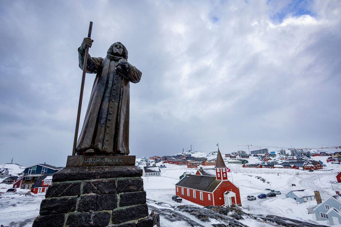 A statue of Hans Egede (1686-1758), a Dano-Norwegian Lutheran missionary, is pictured next to the Cathedral during Sunday service in Nuuk, Greenland, on March 9, 2025.