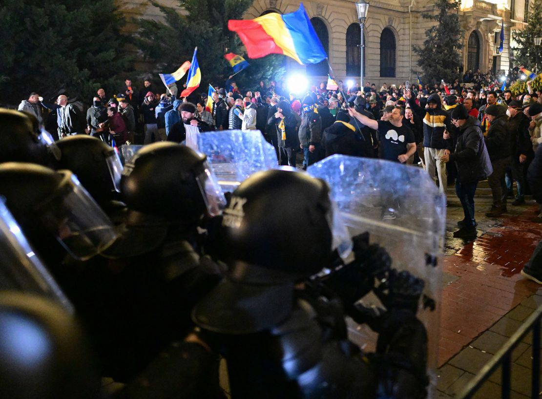 Georgescu supporters clash with police outside the Central Election Bureau in Bucharest, March 9, 2025.