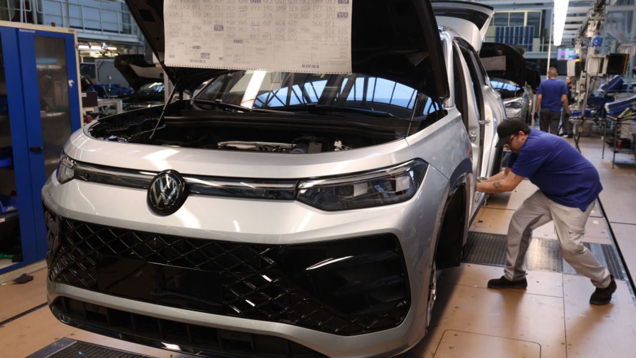 WOLFSBURG,  - MARCH 07: Workers assemb cars on the assembly line at the Volkswagen automobile factory on March 07, 2025 in Wolfsburg, . The factory, which produces the gasoline-powered and hybrid Golf, Tiguan, Touran and Tayron models, churns out over half a million cars a year. Volkswagen faced a sharp decline in global sales last year. The company is seeking to reduce its work force and possibly close some of its German factories. Production at the Wolfsburg plant, however, rose in 2024. (Photo by Sean Gallup/Getty Images)