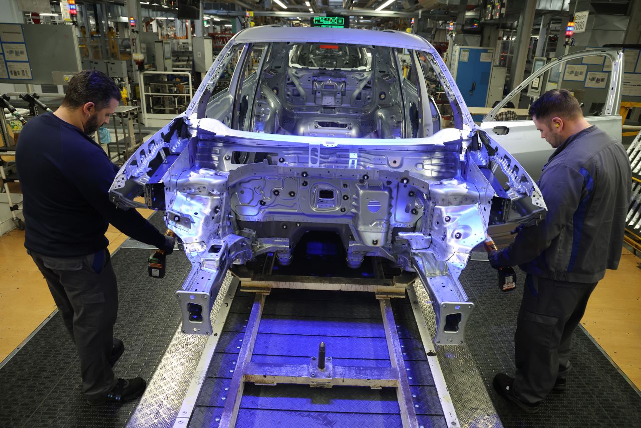 Workers assemble cars at the Volkswagen factory in Wolfsburg, Germany on March 7.