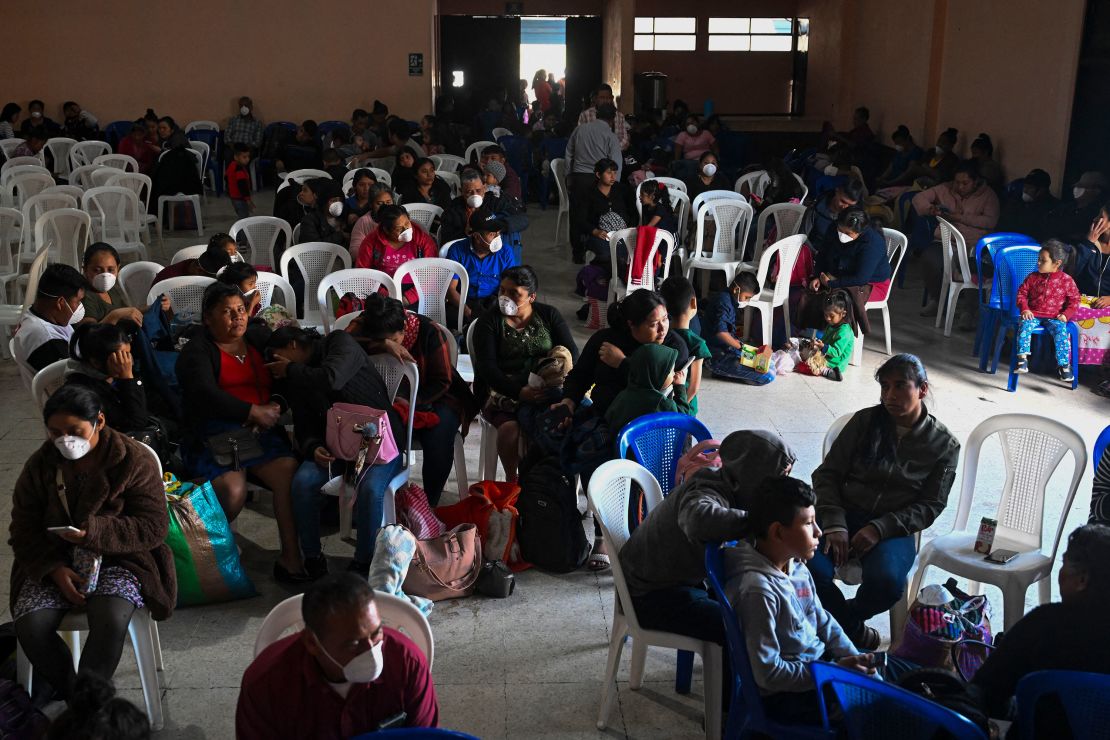 People shelter in Alotenango on Monday after the eruption forced them to evacuate their village.