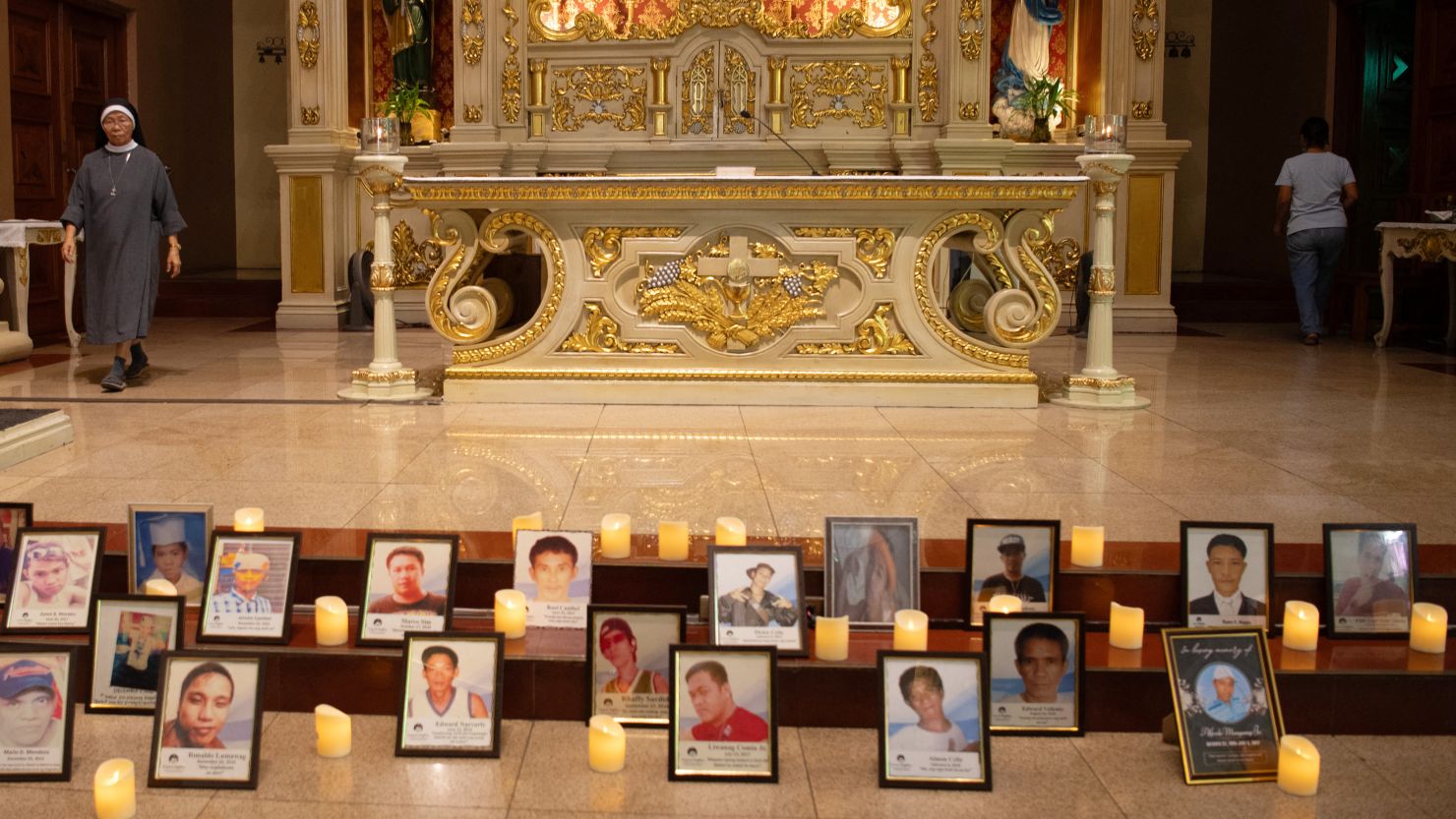 Portraits of victims of former Philippine president Rodrigo Duterte's war on drugs displayed during a mass service on the day former President Rodrigo Duterte was arrested in Manila on March 11, 2025.