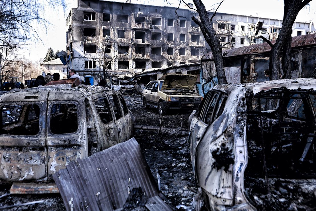 Burnt-out cars stand near a destroyed apartment building after a Russian attack in Dobropillia, eastern Ukraine.