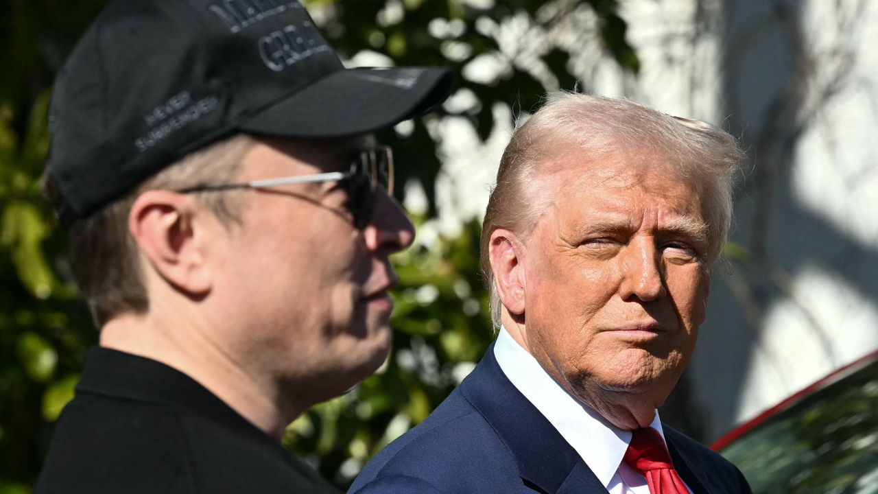 US President Donald Trump and Tesla CEO Elon Musk speak to the press as they stand next to a Tesla vehicle on the South Portico of the White House on March 11, 2025 in Washington, DC.
