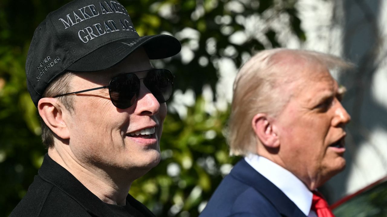 US President Donald Trump and Tesla CEO Elon Musk speak to the press as they stand next to a Tesla vehicle on the South Portico of the White House on March 11, 2025 in Washington, DC. (Photo by Mandel NGAN / AFP) (Photo by MANDEL NGAN/AFP via Getty Images)          