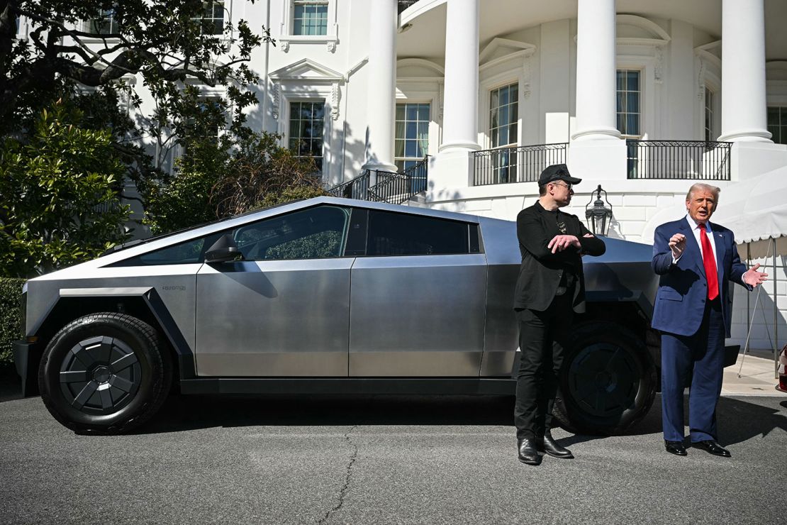 US President Donald Trump and Tesla CEO Elon Musk speak to the press as they stand next to a Tesla Cybertruck on the South Portico of the White House on March 11, 2025 in Washington, DC.