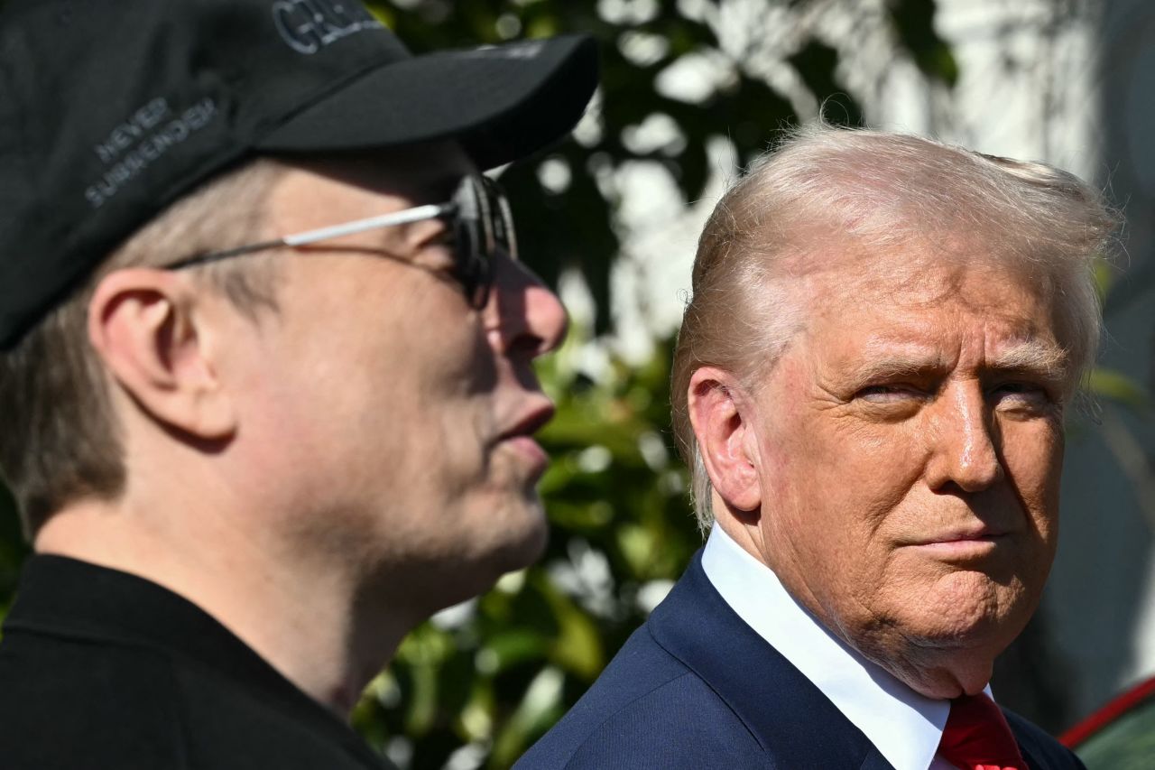 President Donald Trump listens to Elon Musk speak to the press at the South Portico of the White House on March 11.
