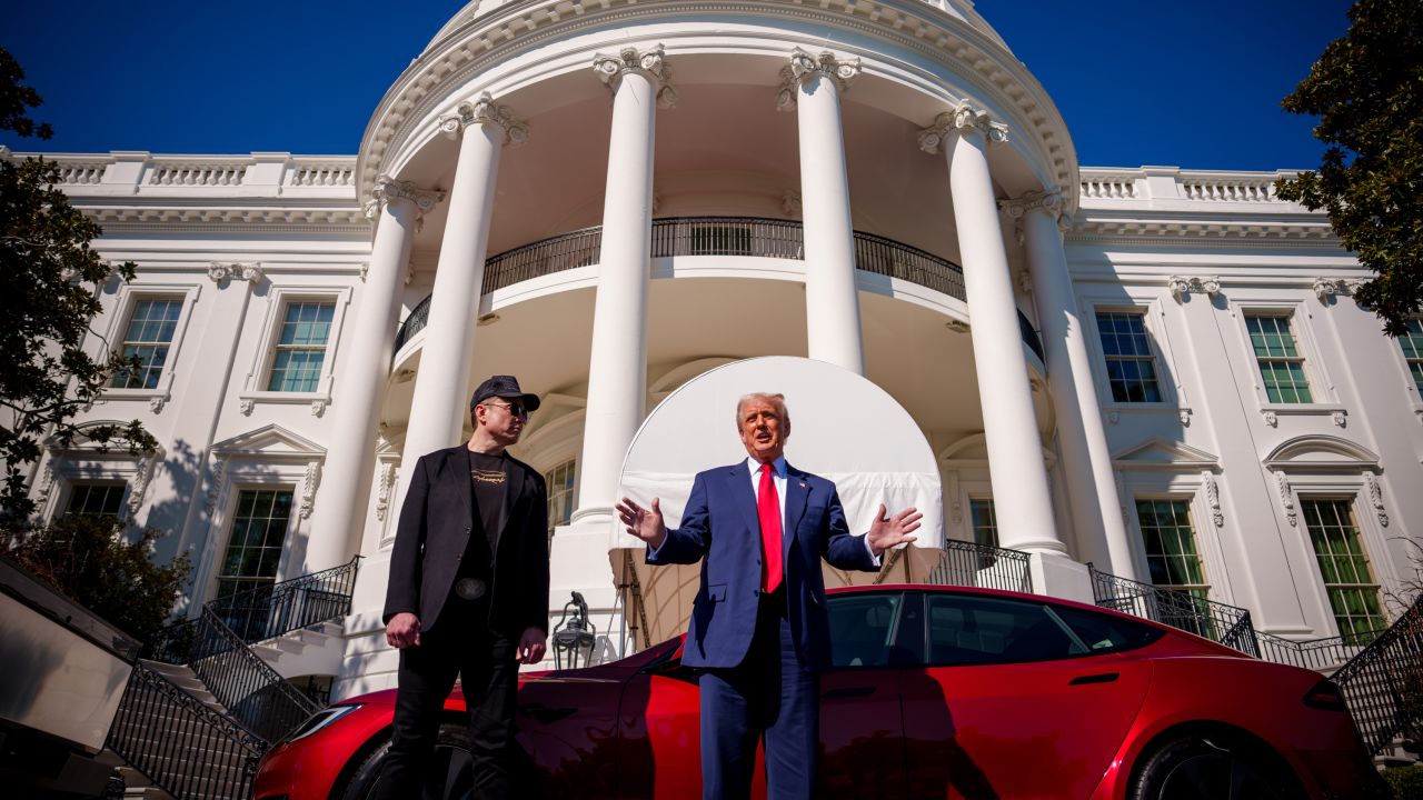 WASHINGTON, DC - MARCH 11: U.S. President Donald Trump, accompanied by White House Senior Advisor, Tesla and SpaceX CEO Elon Musk speaks next to a Tesla Model S on the South Lawn of the White House on March 11, 2025 in Washington, DC. Trump spoke out against calls for a boycott of Elon Musk's companies and said he would purchase a Tesla vehicle in what he calls a 'show of confidence and support' for Elon Musk. (Photo by Andrew Harnik/Getty Images)