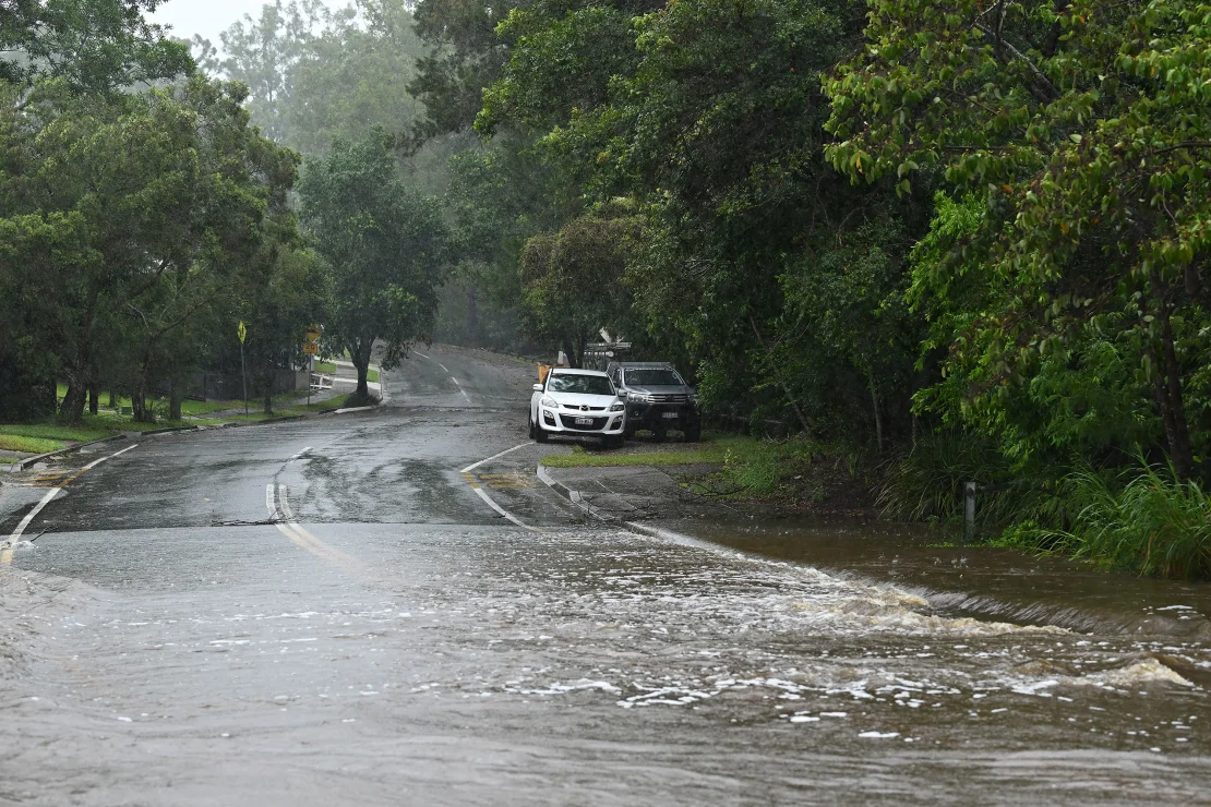 Alfred raises flood risk as tropical storm whips Australian coast with wind and rain